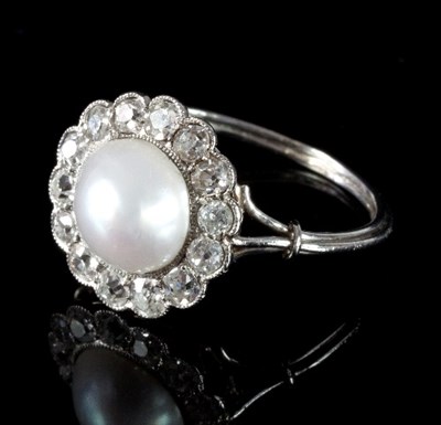 Lot 498 - A pearl and diamond cluster ring, the pearl to...