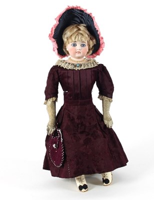 Lot 549 - A bisque head doll, unmarked, circa 1880,...