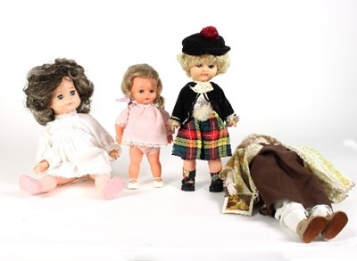 Lot 573 - A group of four modern dolls, to include a...