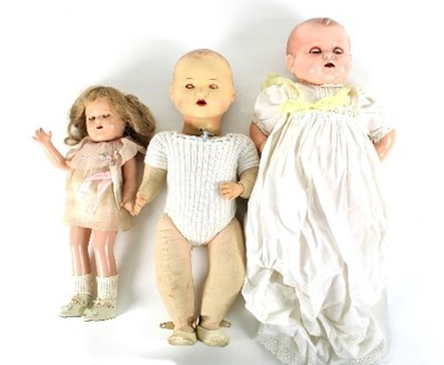 Lot 574 - A group of three early 20th Century dolls, to...