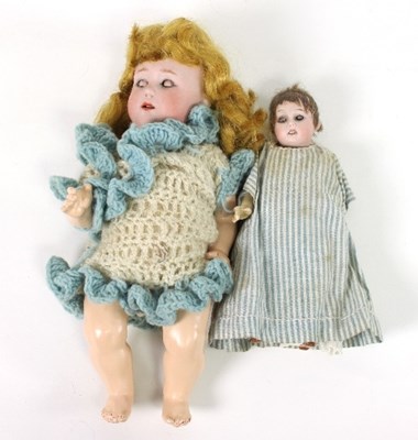 Lot 578 - A small German bisque head doll, dressed in...