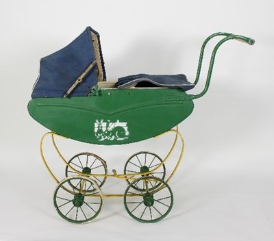 Lot 592 - A dolls green painted pram with wrought iron...