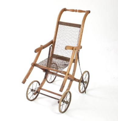 Lot 609 - A wooden framed folding pram, with chain seat...