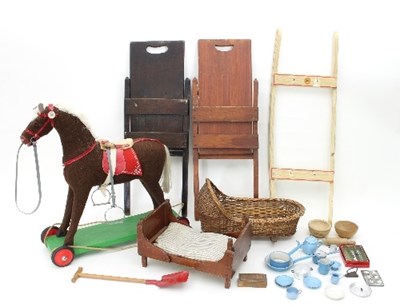 Lot 614 - A child's pull along horse with changeable...