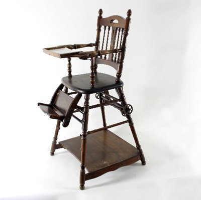 Lot 623 - A child's metamorphic high chair with spindle...