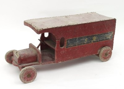 Lot 624 - A wooden post van, painted red and initialled...