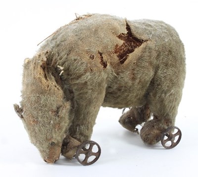 Lot 625 - A Steiff polar bear, circa 1915, on four metal...