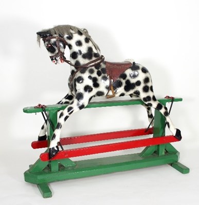 Lot 647 - An early 20th Century rocking horse, dapple...