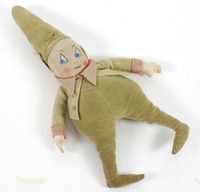 Lot 656 - A pixie rag type doll with pointed hat and...