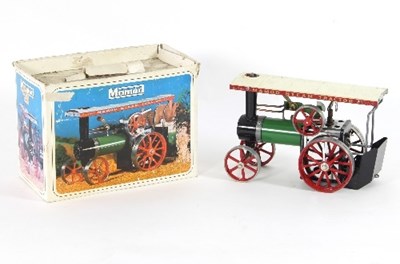 Lot 657 - A Mamod engine, two train sets and a boat