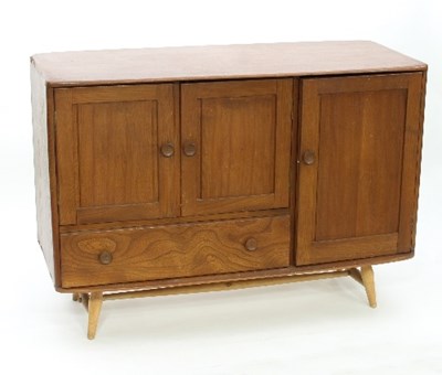 Lot 3 - An Ercol elm sideboard, fitted a single panel...