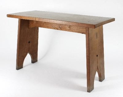 Lot 5 - Manner of Liberty & Co: An Arts and Crafts oak...