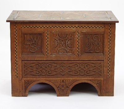 Lot 9 - An Arts and Crafts oak mule chest of small...