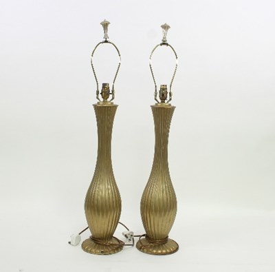 Lot 44 - A pair of reeded gilt metal table lamps, 60cm...