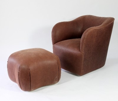 Lot 48 - A brown leather upholstered tub armchair by J...