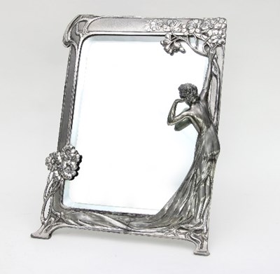 Lot 76 - An Art Nouveau silver coloured metal framed...