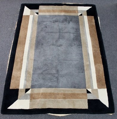 Lot 86 - A mid 20th Century rug with geometric design...