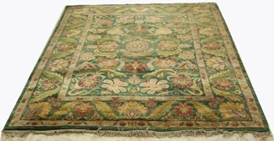 Lot 92 - An Arts and Crafts style carpet with bold...