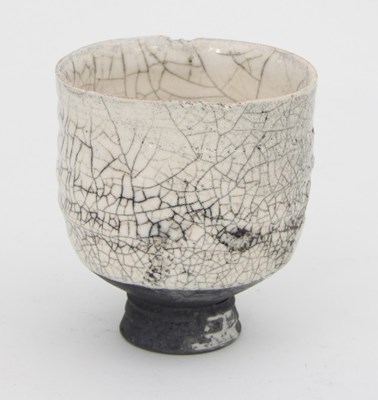 Lot 113 - A Raku footed bowl of slightly misshapen ovoid...