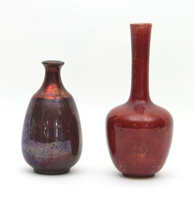 Lot 122 - A Burmantofts red faience flambe glazed bottle...