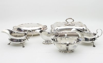 Lot 345 - A silver plated double-spouted gravy boat, a...