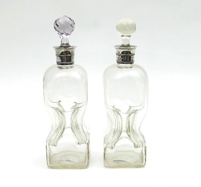 Lot 350 - A pair of Victorian silver mounted decanters,...