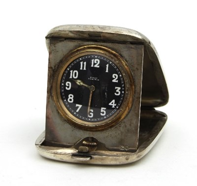 Lot 351 - A silver cased travelling bedside clock, the...