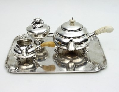 Lot 384 - Georg Jensen: a 'Blossom' pattern silver tea...