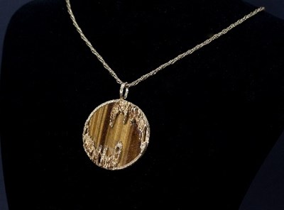 Lot 392 - Kutchinsky: a tiger's eye and 18ct gold...