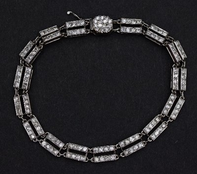 Lot 415 - A diamond set bracelet set in platinum, the...