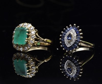 Lot 416 - An emerald and diamond cluster ring, the...