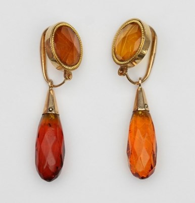 Lot 421 - A pair of amber ear pendants, each of circular...