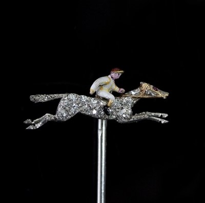 Lot 423 - A gem set racehorse tie pin, with enamel...