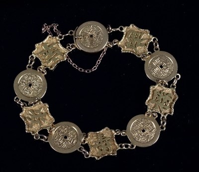 Lot 455 - A Chinese export gold bracelet, Wang Hing,...