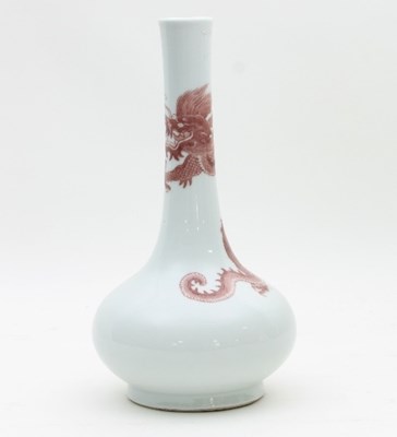 Lot 473 - A Chinese red and white bottle vase, bearing...