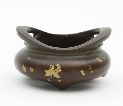 Lot 479 - A Chinese small gold splash and patinated...