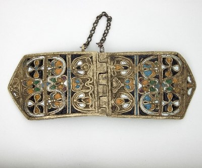 Lot 484 - An Islamic brass buckle, with filled enamel to...