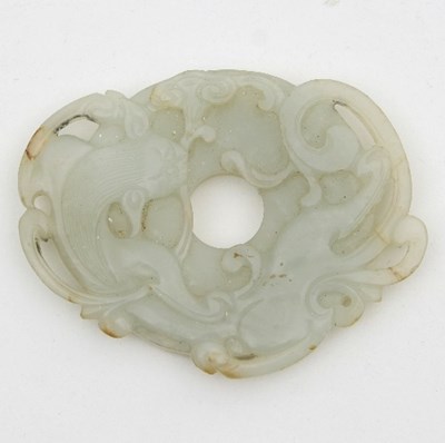 Lot 488 - A Chinese jade Bi disc carved with a swirling...