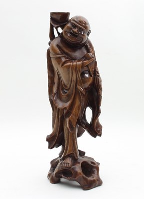 Lot 490 - A Japanese carved hardwood figure of a monk,...