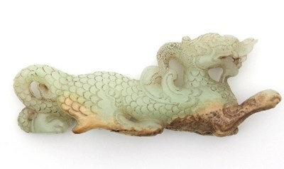 Lot 496 - A Chinese white and russet jade carving of a...