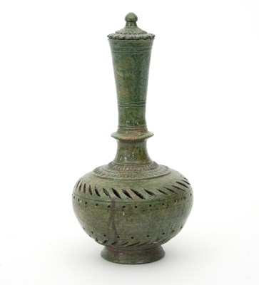 Lot 503 - An Indian green glazed pierced bottle vase and...