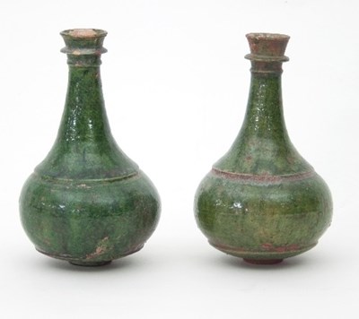 Lot 504 - A pair of Indian green glazed incense burners...