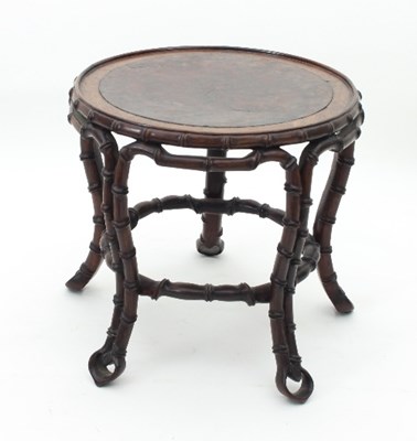 Lot 506 - An Oriental stand, the circular top with inset...