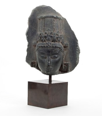 Lot 507 - An early Rajasthan stone head with conical...