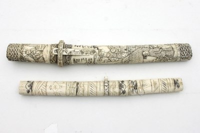 Lot 529 - A Japanese carved bone handled tanto, the...