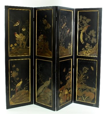 Lot 539 - A Chinese lacquered screen, the four panels...