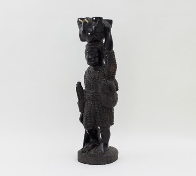 Lot 571 - A carved hardwood tribal figure, Benin, mid...