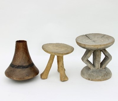 Lot 577 - A hide skin drum, two stools and a turned wood...