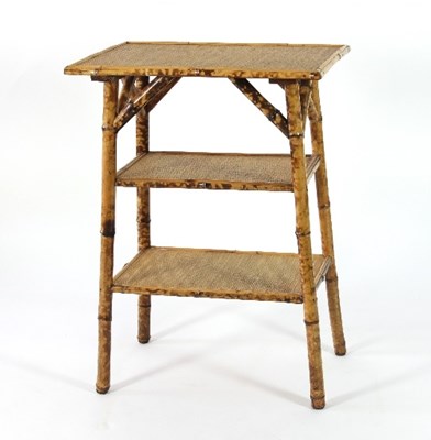 Lot 690 - A bamboo three-tier occasional table with...