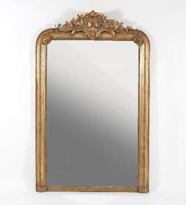 Lot 695 - A plaster gilt overmantel mirror with shell...